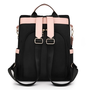 Women's black nylon backpack with pink leather trim and adjustable straps for travel
