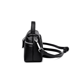 Minimalist black lychee texture leather shoulder bag with silver hardware side view