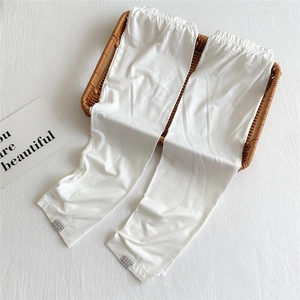 Detail of white cooling ice silk sun protection arm sleeves with elastic cuffs