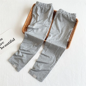 Detail showing elastic waistband and breathable grey fabric texture of summer cooling sleeves