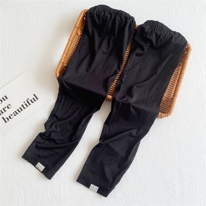 Detail of black ice silk sun protection sleeves with elastic waistband and woven logo