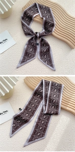 Détail d'un foulard en soie à motif éléphant et imprimé géométrique comme bandeau décoratif