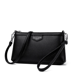 Sac bandoulière classique en cuir noir litchi avec fermeture éclair argentée