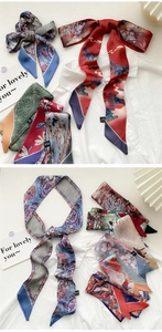 Detailed view of colorful oil painting style silk scarves for neck and bag decoration