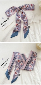 Floral print narrow silk scarf styled as a neckerchief on a white shirt collar