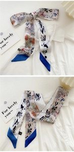 Detail view of double-sided silk skinny scarf with landscape print and calligraphy art