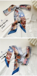 Detailed macro of 100% silk twilly scarf with oil painting print on a white shirt