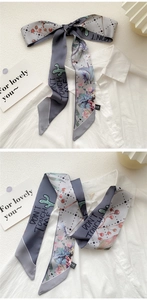 Detail of artistic oil painting scarf with cactus floral print and letter typography