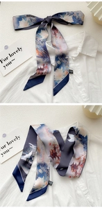 Detail of oil painting silk scarf tied on white shirt with traditional lotus and crane print