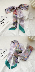Detail of floral oil painting satin twilly scarf tied on white shirt with Happy Holidays text
