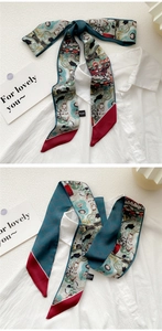 Detail showing vintage oil painting style silk scarf tied on a white shirt collar