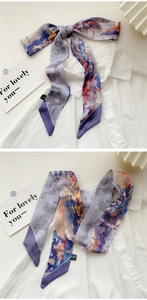Detail of oil painting style purple silk scarf tied on a white shirt in two styles