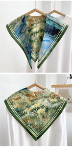 Close-up of artistic Van Gogh style silk scarf with vibrant blue and yellow oil painting patterns