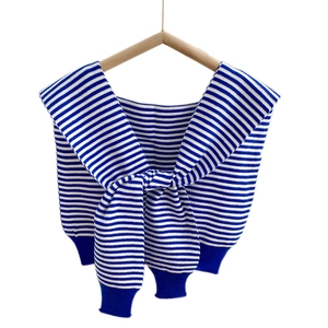 Classic blue and white striped knit shawl wrap with a decorative front knot on hanger