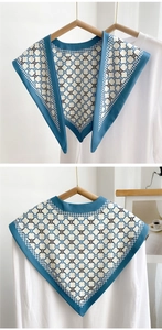 Detail of vintage geometric pattern on blue detachable collar shawl with silk texture