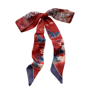 Red oil painting silk scarf with classical floral and mountain patterns tied in a bow