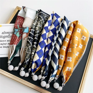 Silk scarf necklace with magnetic buckle and diamond-encrusted pendant in various prints