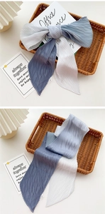 Detailed view of blue gradient pleated skinny scarf with elegant accordion texture