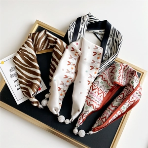 Silk neck scarves collection with magnetic clasps and rhinestone pendants in varied prints