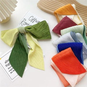 Pleated gradient scarf in green and yellow displayed with multiple color options