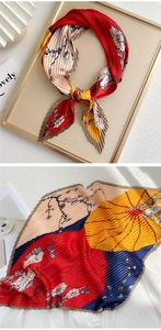 Detail of pleated silk scarf with floral print and colorful color blocking design