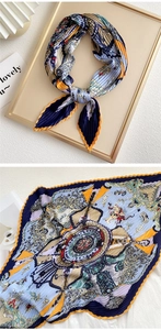 Detail showing pleated silk scarf with vintage pattern and fine accordion fold texture