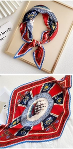 Detail of nautical print pleated silk scarf featuring vintage ship and floral patterns