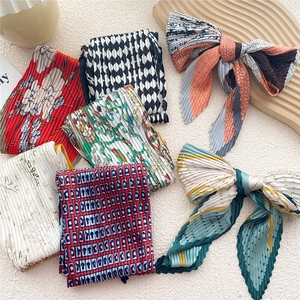 Set of pleated satin neckerchiefs with floral and geometric prints in various colors