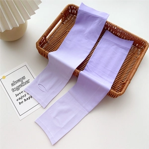 Detail of light purple ice silk sun protection sleeves with thumb holes on a tray