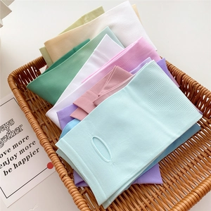 Gradient ice silk sun protection sleeves in pastel colors displayed in a woven basket