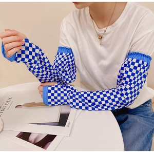 Detail of blue and white checkered sun protection sleeves with elastic cuffs and soft fabric