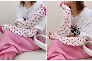 Detail of loose-fit summer ice silk sun protection sleeves with cow and heart prints