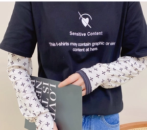Detail of thin ice silk arm sleeves for sun protection with black tee street style