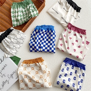 Elastic waist baby shorts set with colorful checkered and cartoon bear prints