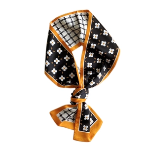 Narrow long silk scarf with houndstooth and floral print in black and orange border