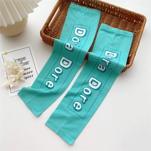 Detail of mint green ice silk sun protection sleeves with breathable mesh and stylish logo