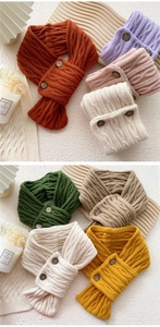 Detail of chunky cable knit scarves featuring retro decorative buttons in multiple colors
