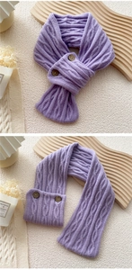 Detailed knit texture and brown buttons on a purple winter scarf for women
