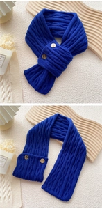 Detail view of Klein blue cable knit scarf with two wooden buttons and warm texture
