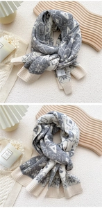 Close-up of dual-color knit scarf featuring geometric patterns and ribbed ends