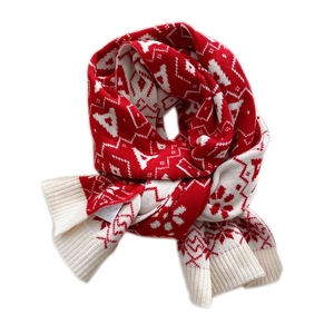 Winter knit scarf with red and white snowflake patterns and soft ribbed ends