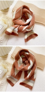 Close-up of caramel diamond lattice knitted scarf with warm winter college style texture