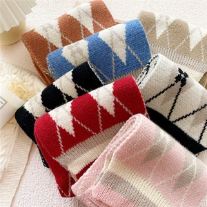 Cozy knit scarf for women featuring classic argyle diamond patterns and soft ribbed edges