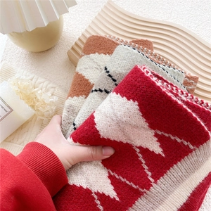 Short knitted scarf with diamond lattice pattern in cozy winter style for women