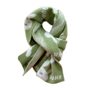 Short bunny knit scarf in green with white bunny pattern and BUNNY text for winter