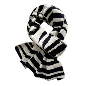Classic knitted scarf with thick black and white stripes for winter warmth and comfort