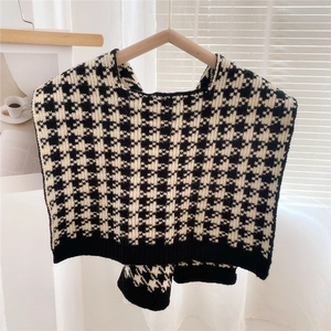 Macro shot of thick black and white houndstooth knit pattern with premium texture