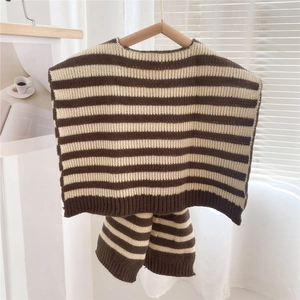 Detailed knit texture of the brown and cream striped scarf vest with ribbed edging