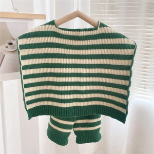 Detail of green and white striped knitted baby set featuring vest and matching shorts