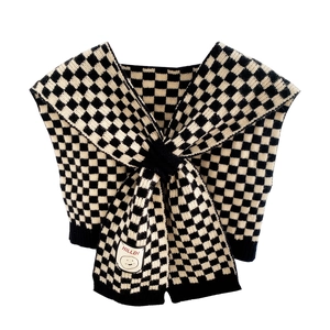 Checkerboard knit scarf shawl with smiley face patch and cross-loop fastening